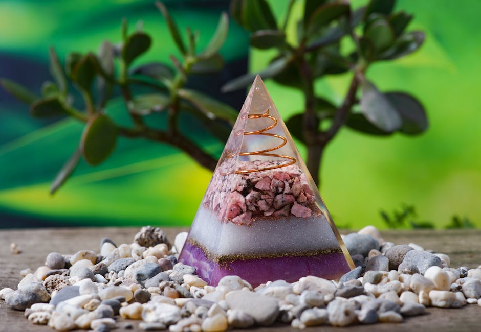 Orgone pyramid combining crystals, metals, and resin for EMF harmonization in the home
