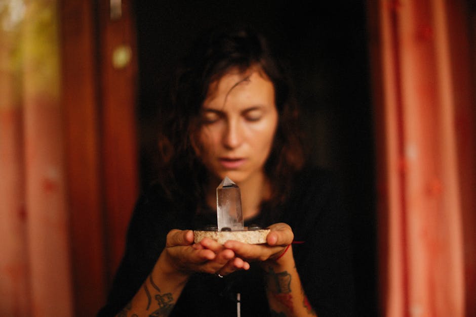 Woman meditating with lepidolite for calm and anxiety relief